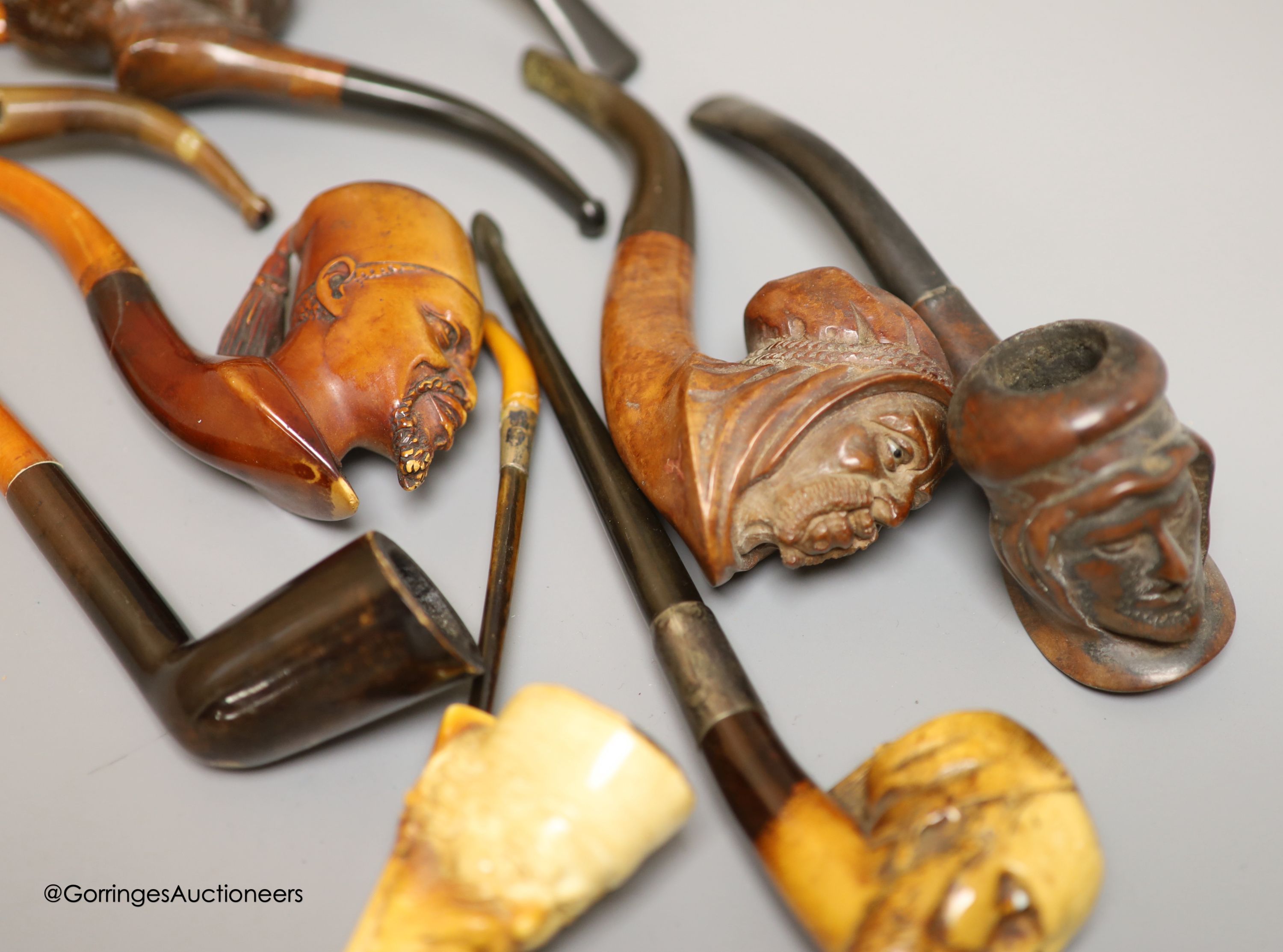 An Inuit stone bear and a collection of Meerschaum pipes